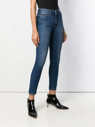 Shop Versace Mid Rise Studded Skinny Jeans In Blue