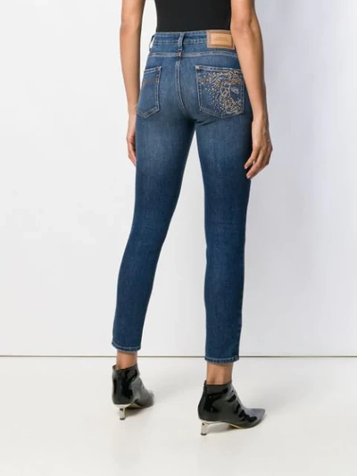 Shop Versace Mid Rise Studded Skinny Jeans In Blue