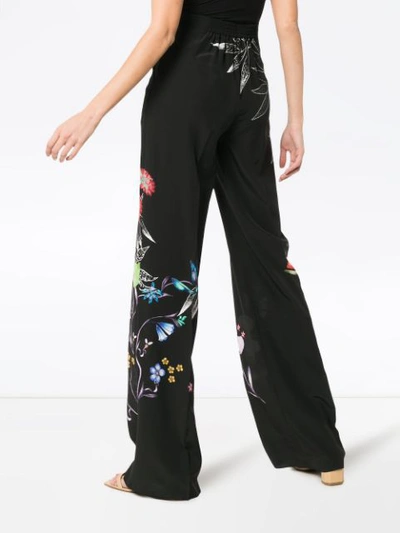 Shop Etro Wide Leg Floral Print Trousers In Black