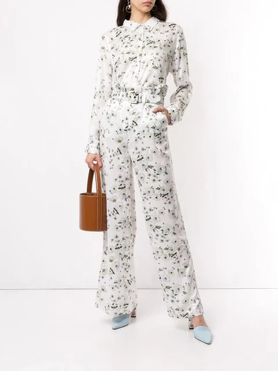 Shop We Are Kindred Belted Palazzo Trousers In White