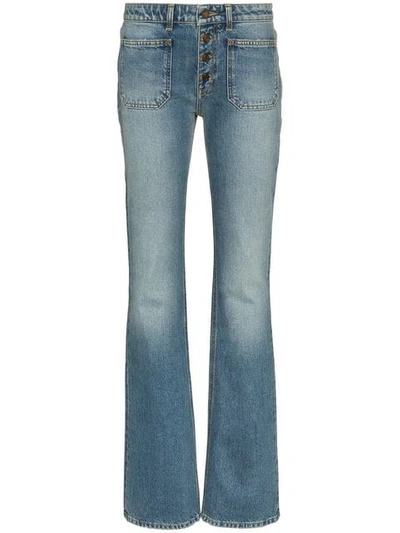 Shop Saint Laurent Button Up Flared Jeans In Blue