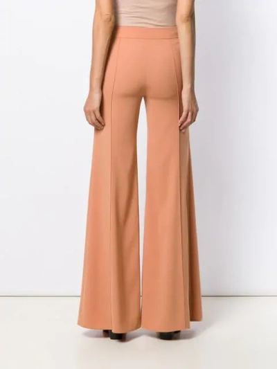 Shop Chloé Flared Trousers In Brown