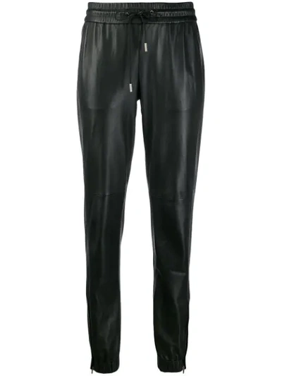 Shop Saint Laurent Leather Track Pants In Black