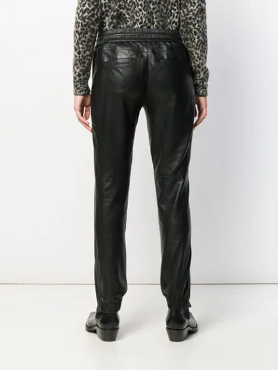 Shop Saint Laurent Leather Track Pants In Black