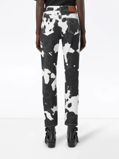 Shop Burberry Straight Fit Cow Print Jeans In Black