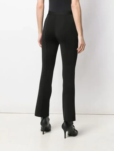 Shop Givenchy High-waisted Flared Trousers In Black
