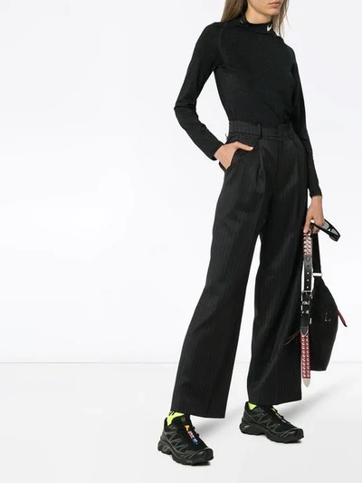 Shop Ader Error Pinstripe Flared Trousers In Black