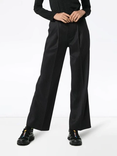 Shop Ader Error Pinstripe Flared Trousers In Black