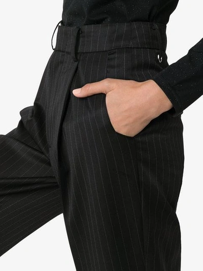 Shop Ader Error Pinstripe Flared Trousers In Black