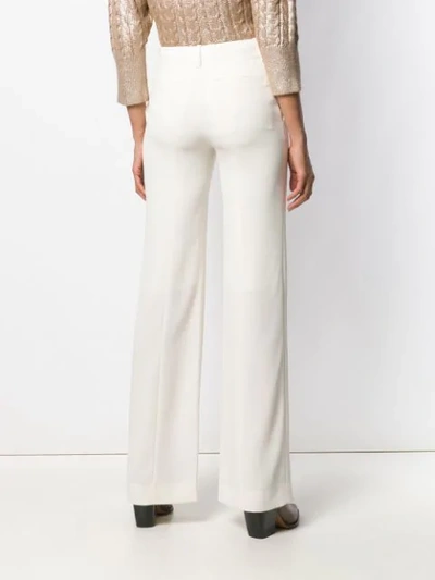 Shop Chloé Flared Trousers In White