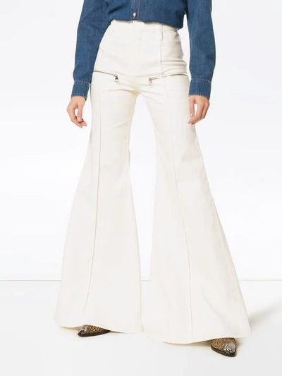 Shop Chloé Zipped Flared Jeans In White