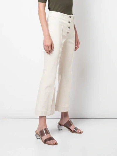 Shop Rosetta Getty Cropped Flare Jeans In White