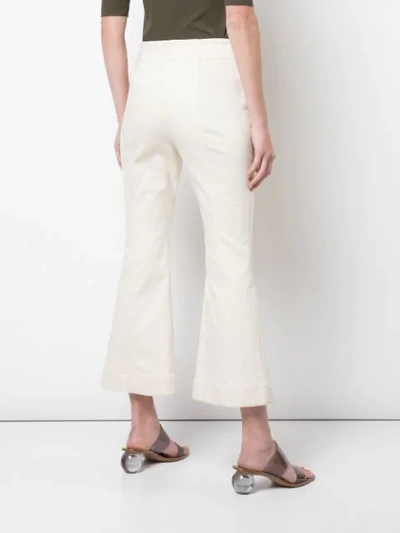 Shop Rosetta Getty Cropped Flare Jeans In White