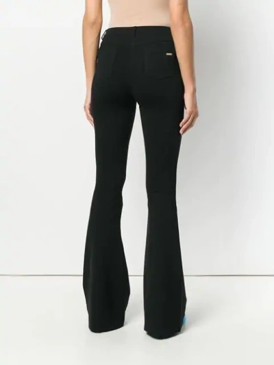 Shop Blumarine Flared Trousers In Black