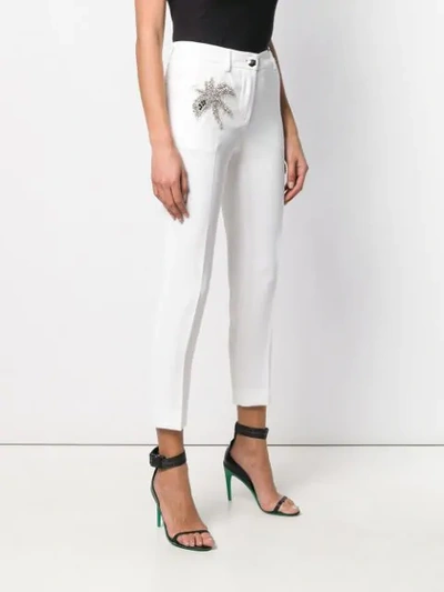 Shop Philipp Plein Embellished Patch Trousers In White