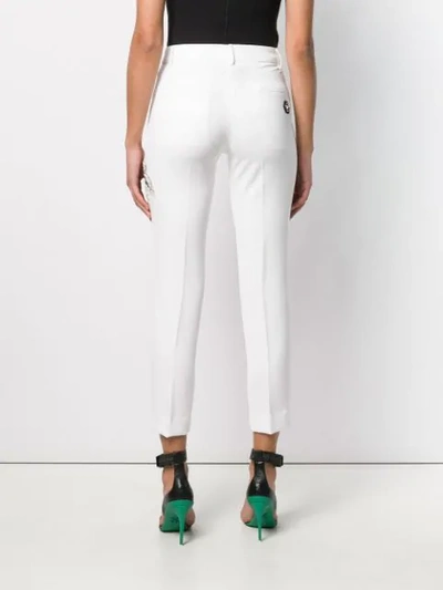 Shop Philipp Plein Embellished Patch Trousers In White
