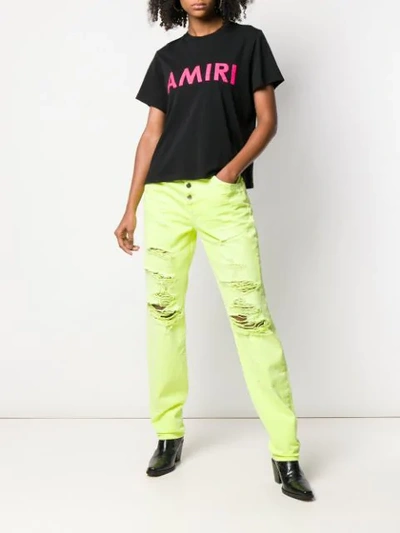 Shop Amiri Distressed Slouch Jeans In Yellow