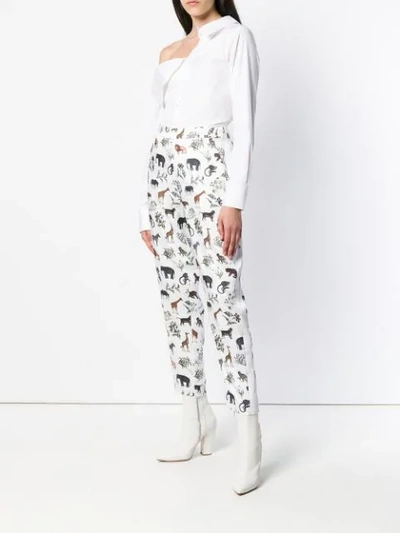 Shop Victoria Beckham Cropped Safari Print Trousers - White