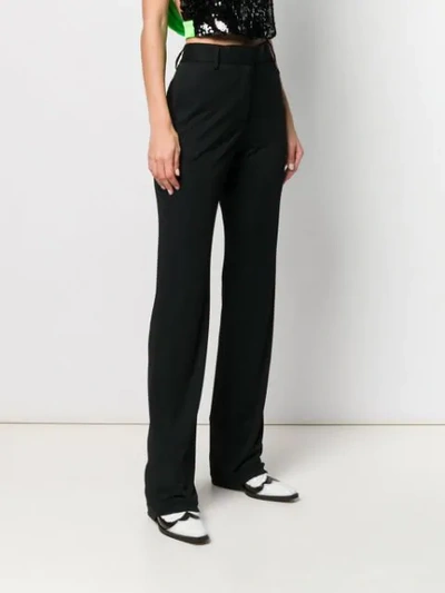 Shop Msgm Flared Style Trousers In Black