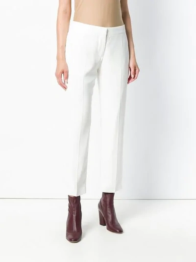 Shop Alexander Mcqueen Kickback Trousers In White
