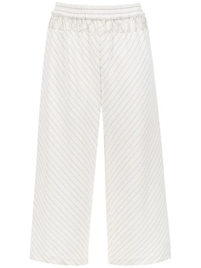 Shop À La Garçonne Striped Trousers In White