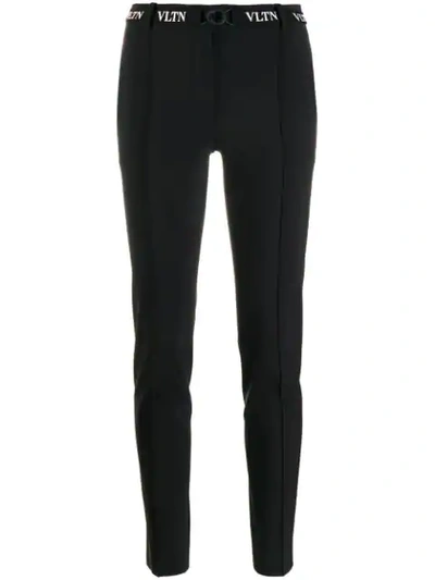 Shop Valentino Belted Vltn Skinny Trousers In Black