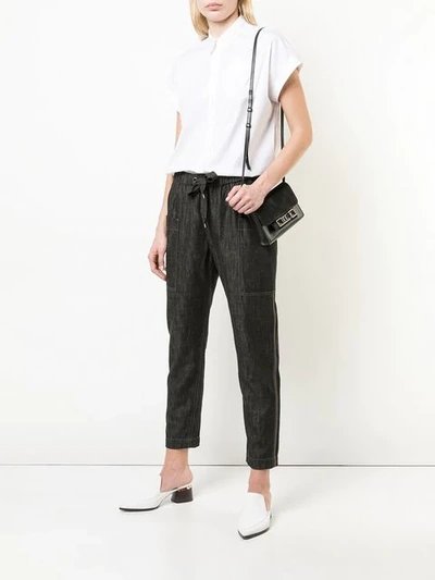 Shop Brunello Cucinelli Tapered Denim Style Trousers In Black