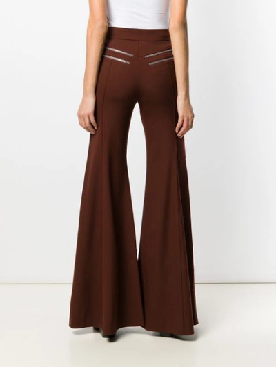 Shop Chloé Flared Trousers In Red