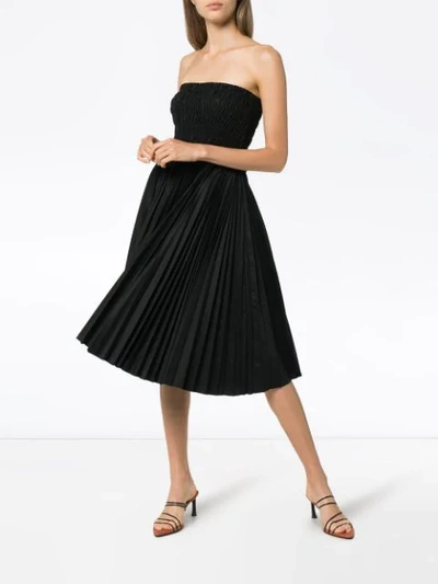 Shop Khaite Rosa Smocked Midi Dress In Black