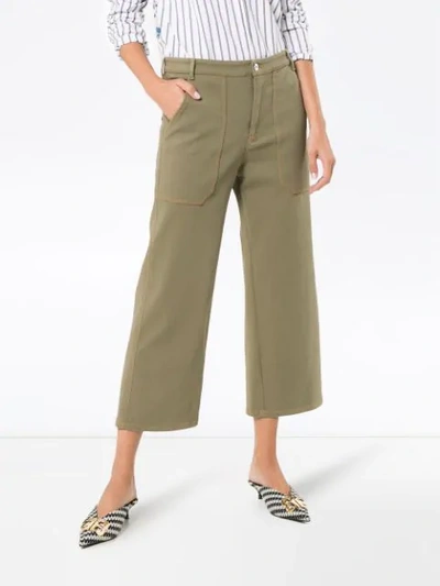 Shop Miu Miu Mid Rise Studded Cropped Wide-leg Jeans In Green