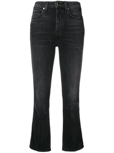 Shop Khaite Cropped Flared Jeans - Black