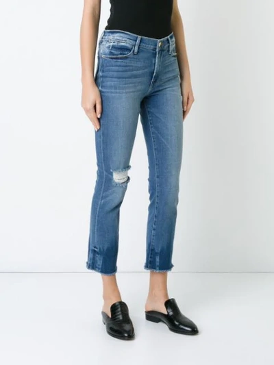 Shop Frame Raw Edge Cropped Jeans In Blue