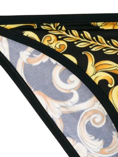 Shop Versace Jeans Hibiscus Print Bikini Bottoms In A732d Black Gold