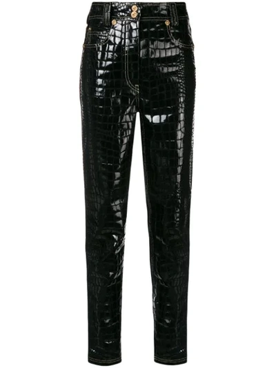 Shop Versace Croco-embossed Trousers - Black