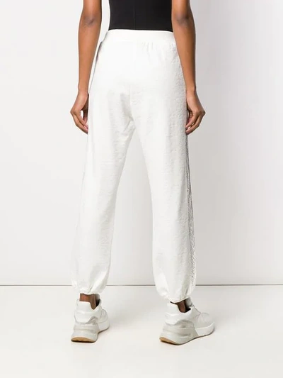 Shop Pinko Embroidered Track Style Trousers In White