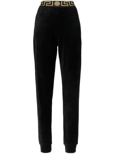 Shop Versace Greek Key-trimmed Velvet Joggers In Black