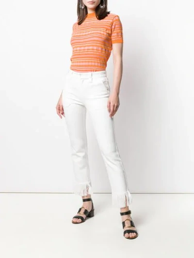 Shop Chloé Fringe Trimmed Jeans In White