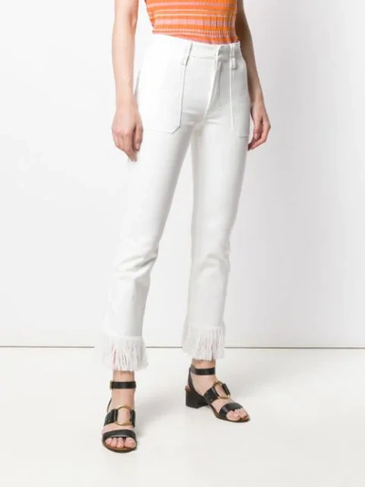 Shop Chloé Fringe Trimmed Jeans In White