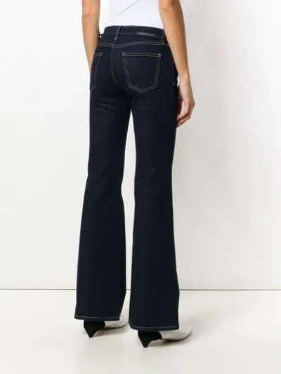 Shop Current Elliott Flared Jeans In Blue