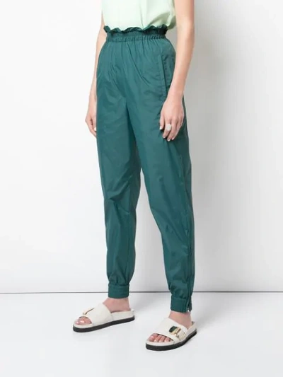 Shop Tibi Jogger Tapered Trousers In Green