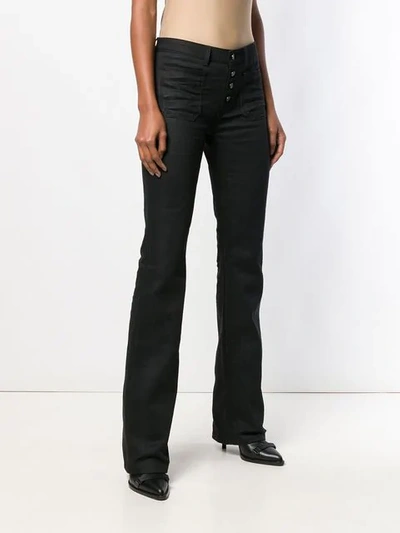 Shop Saint Laurent Mid-rise Flared Jeans In Black