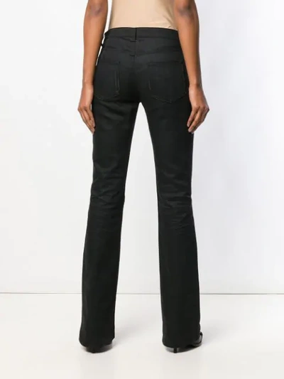 Shop Saint Laurent Mid-rise Flared Jeans In Black