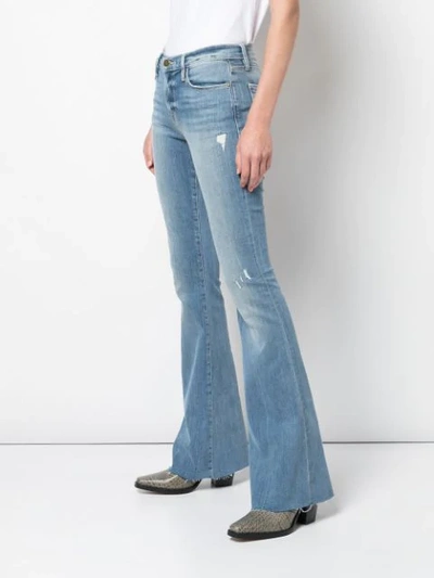 Shop Frame Bootcut Jeans In Blue