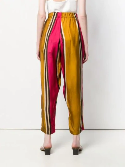 Shop Uma Wang Striped High-waisted Trousers In Orange
