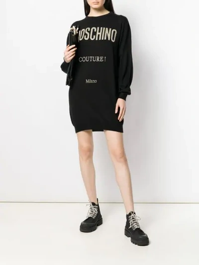 Shop Moschino Logo Sweater Dress In Black
