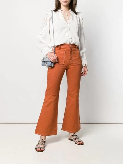 Shop See By Chloé Contrast Stitch Flared Trousers In Orange