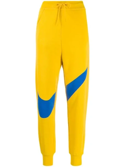 Shop Nike Logo Joggers - Yellow