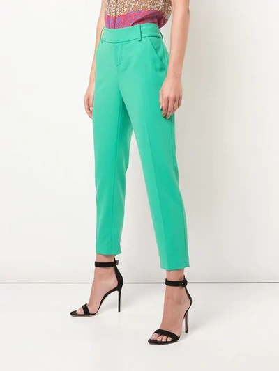 Shop Alice And Olivia Stacey Slim Trousers In Green