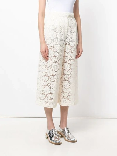 Shop Valentino Sheer Lace Cropped Trousers In Neutrals