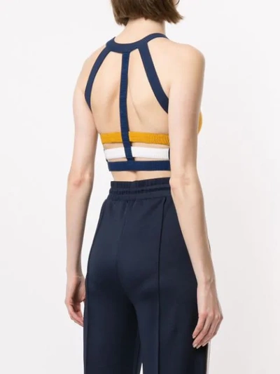 Nagnata Strap Back Crop Sports Top In Turmeric Navy Cream